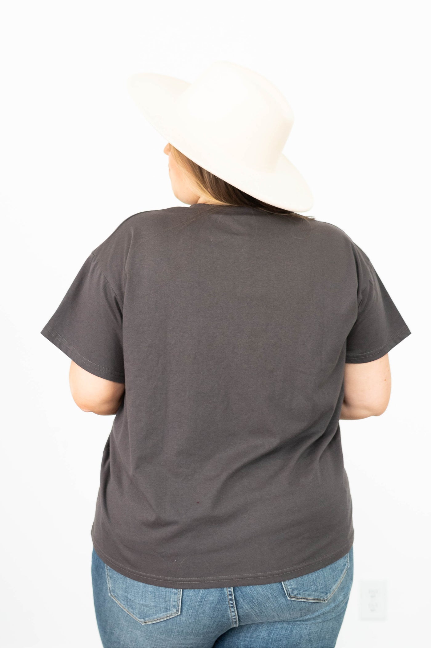 Back view of a plus size charcoal top