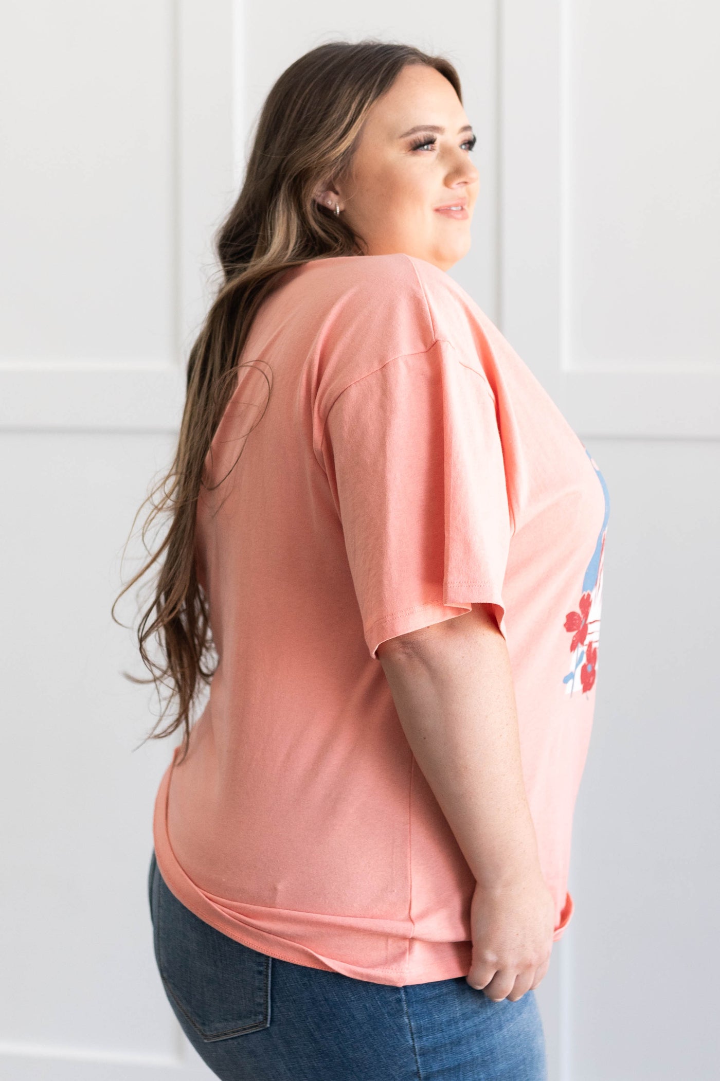 Side view of  a plus size salmon national parks tee