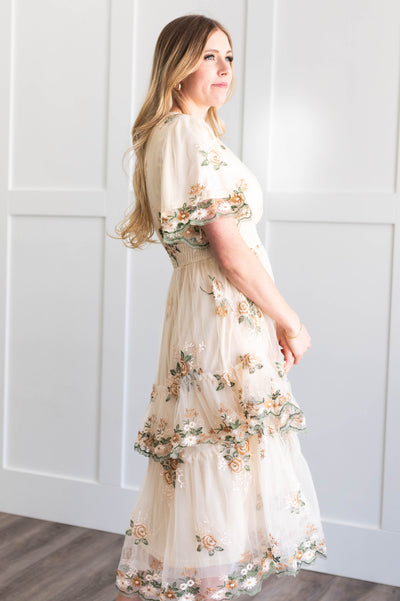 Side view of a cream lace dress
