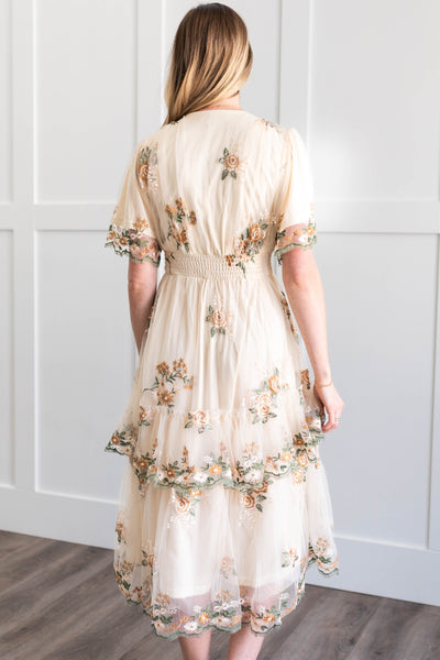 Back view of a cream lace dress