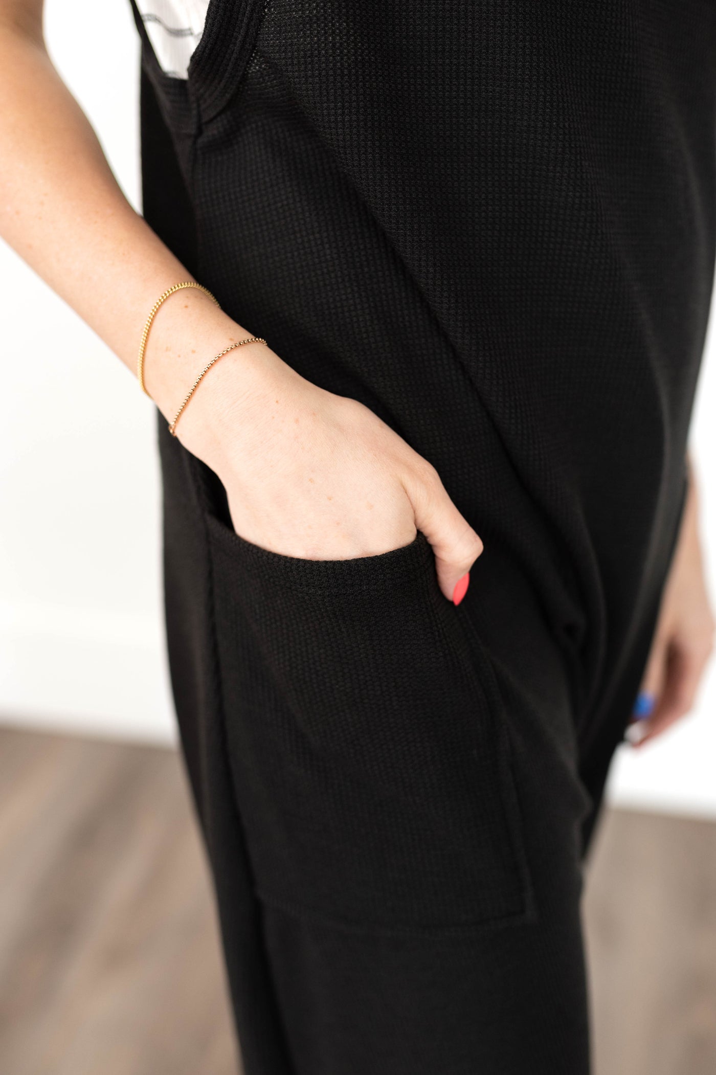 Pocket of a black jumpsuit