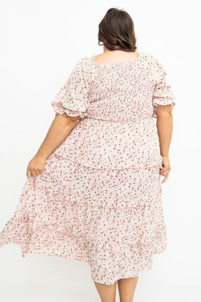 Back view of plus size pink floral dress