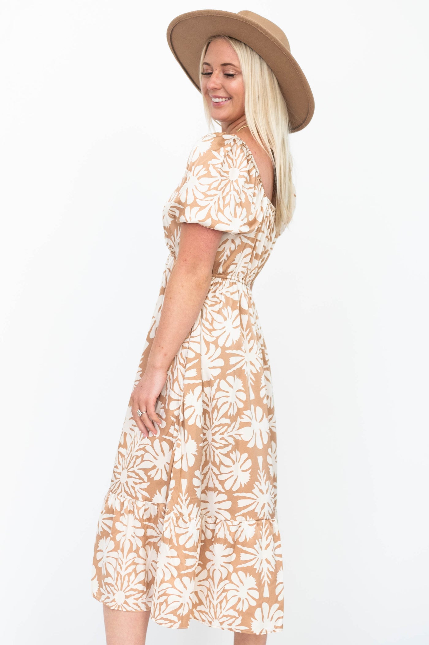 Side view of a taupe floral dress