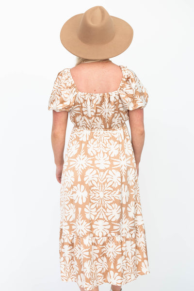 Back view of a taupe floral dress