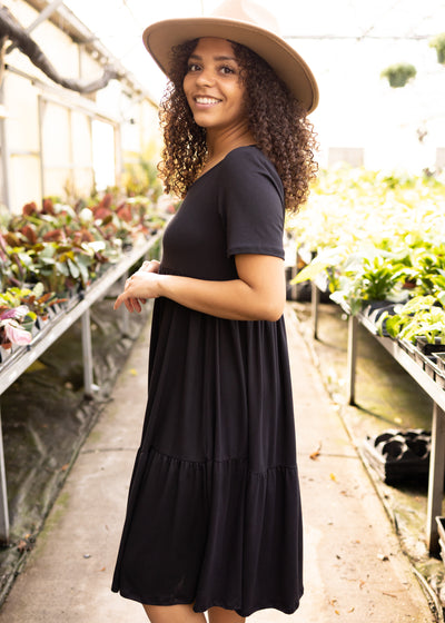 Side view of a knit black dress