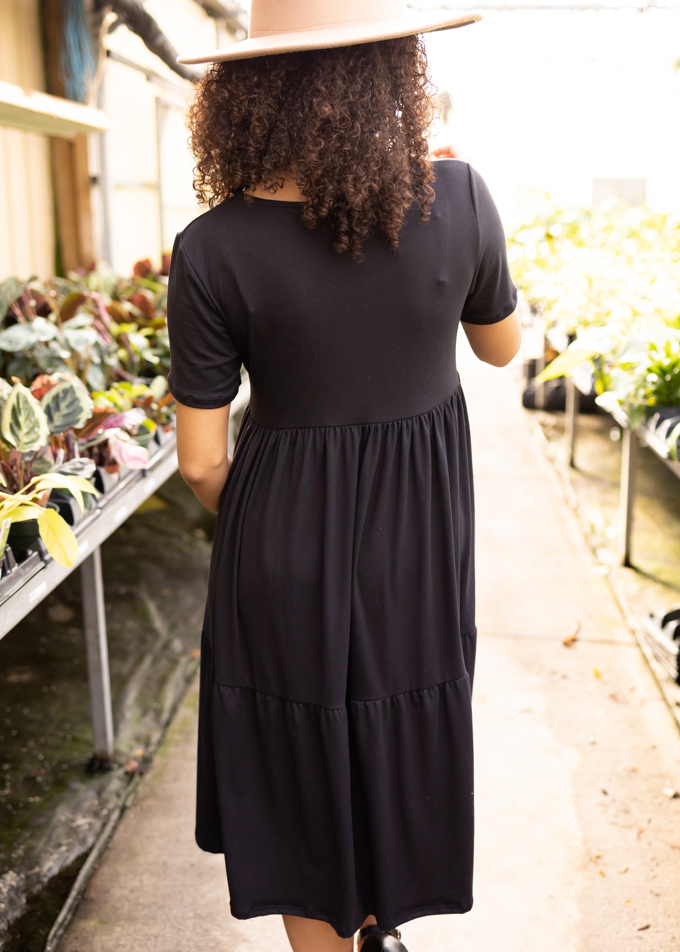 Back view of a short sleeve knit black dress