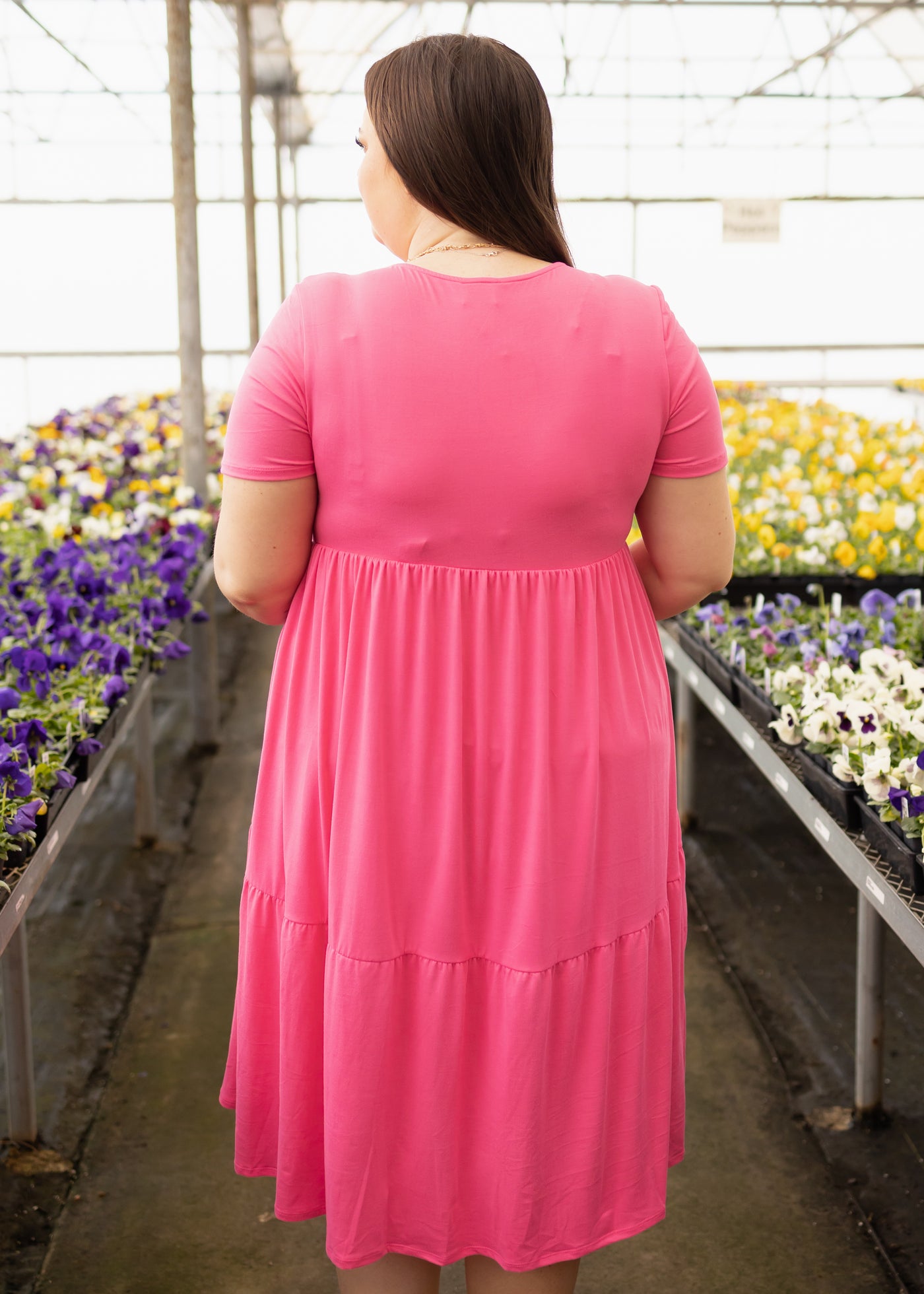 Back view of a plus size fuchsia dress