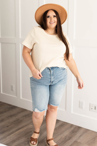 Short sleeve plus size knit cream top with a round neck
