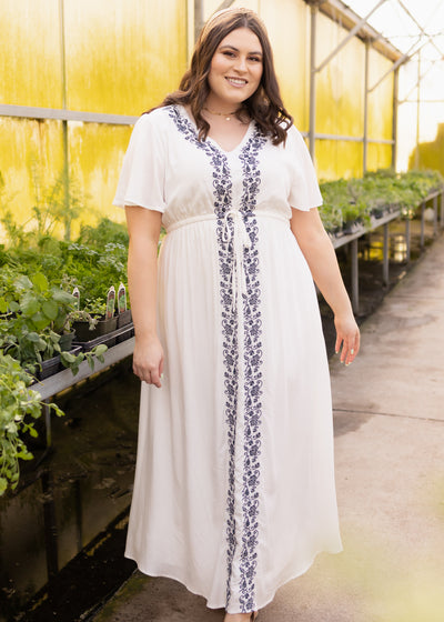 Plus size white dress with navy embroidery and short sleeves