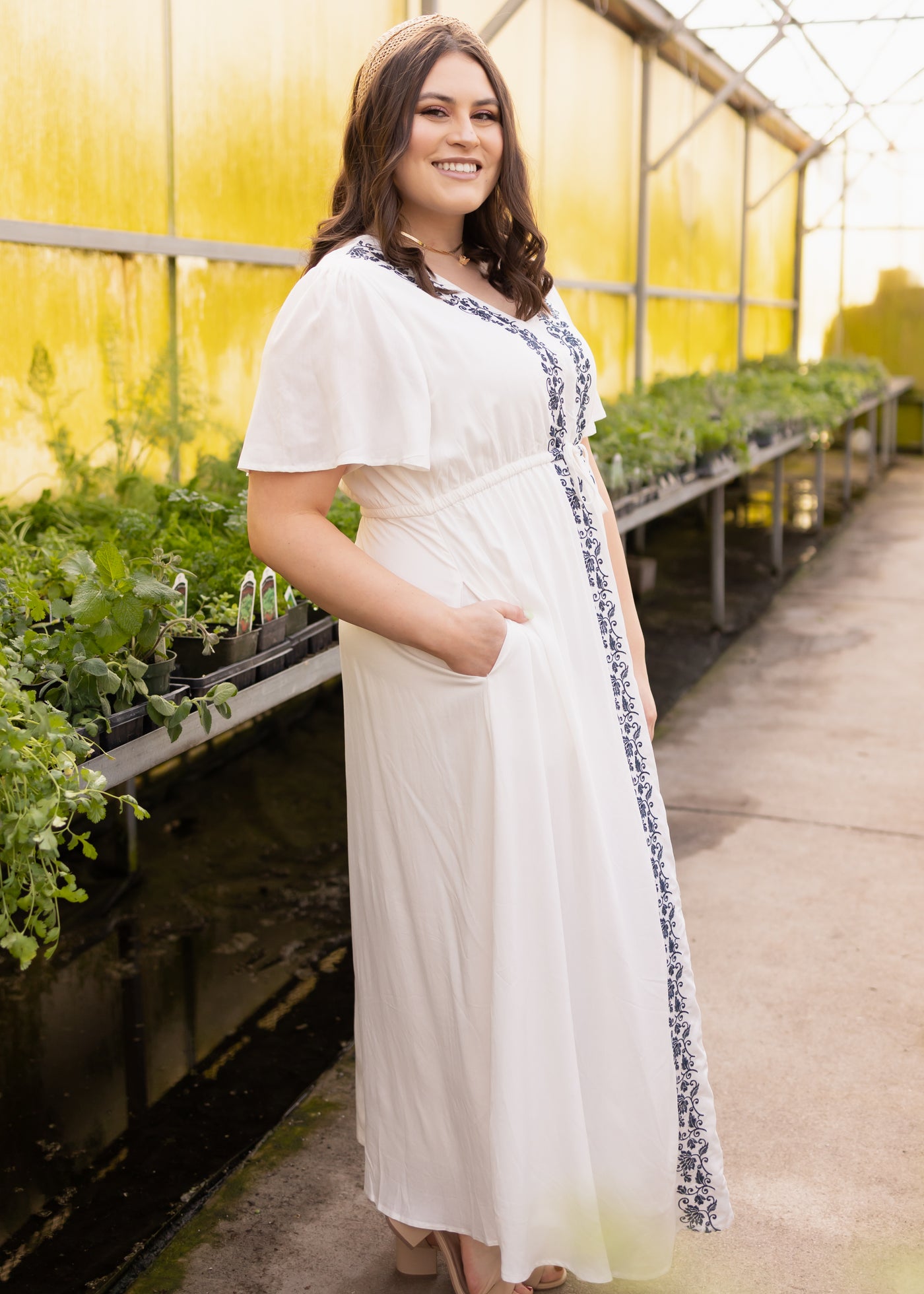 Side view of a short sleeve plus size white dress