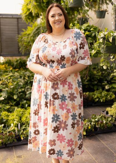 Plus size short sleeve floral dress with earth tone flowers