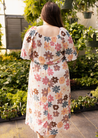 Back view of a plus size floral dress