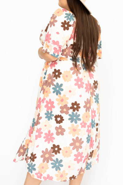 Side view of a plus size floral dress