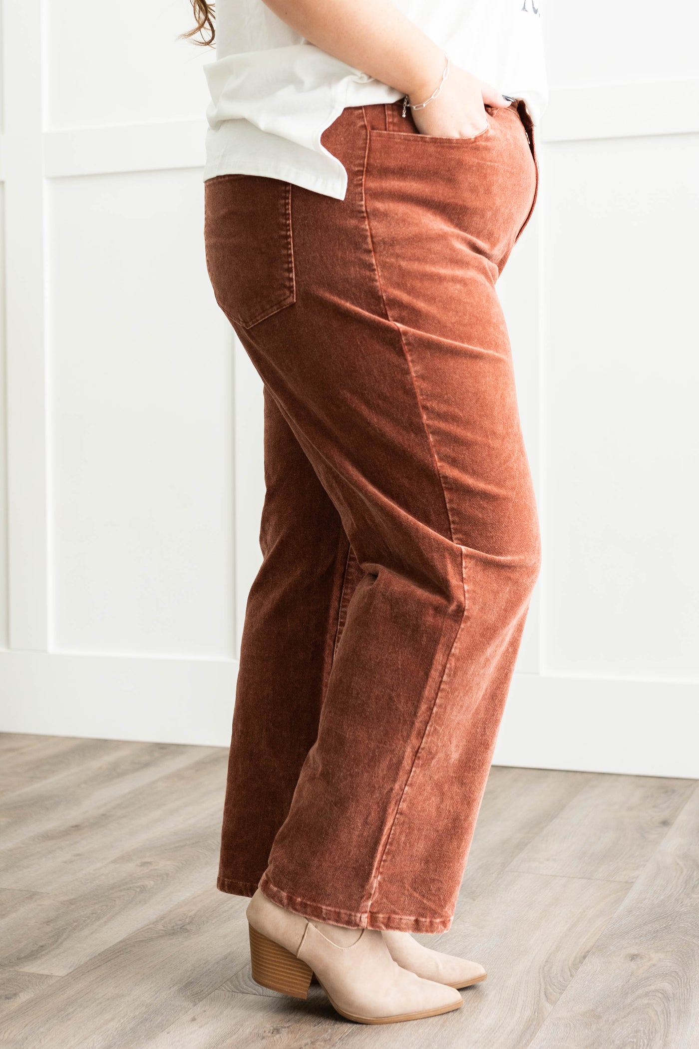 Side view of Plus size brown suede pants