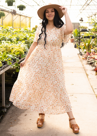 Short sleeve cream floral dress with small red flowers