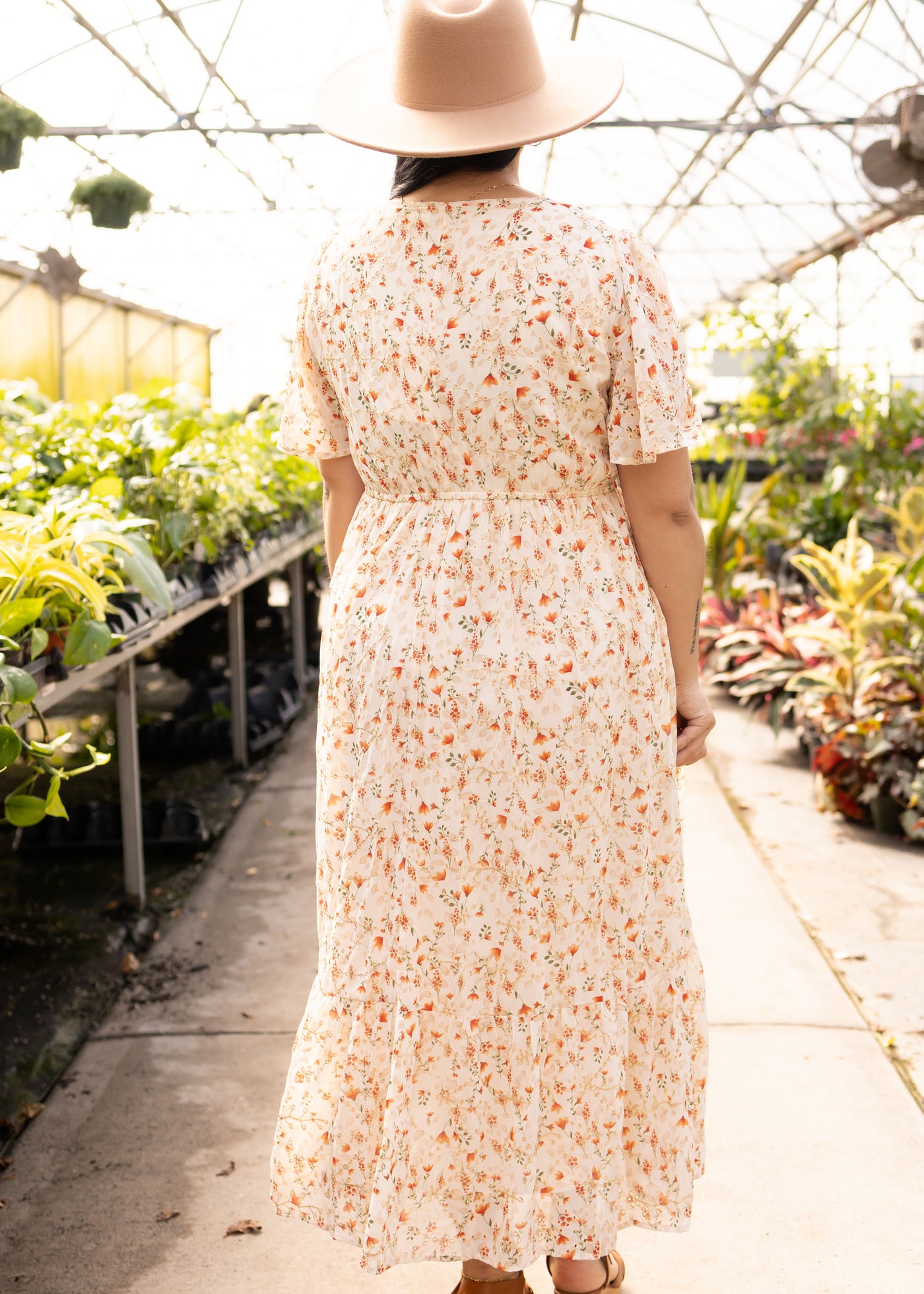 Back view of a cream floral dress