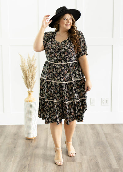 Black floral dress with short sleeves and square neck