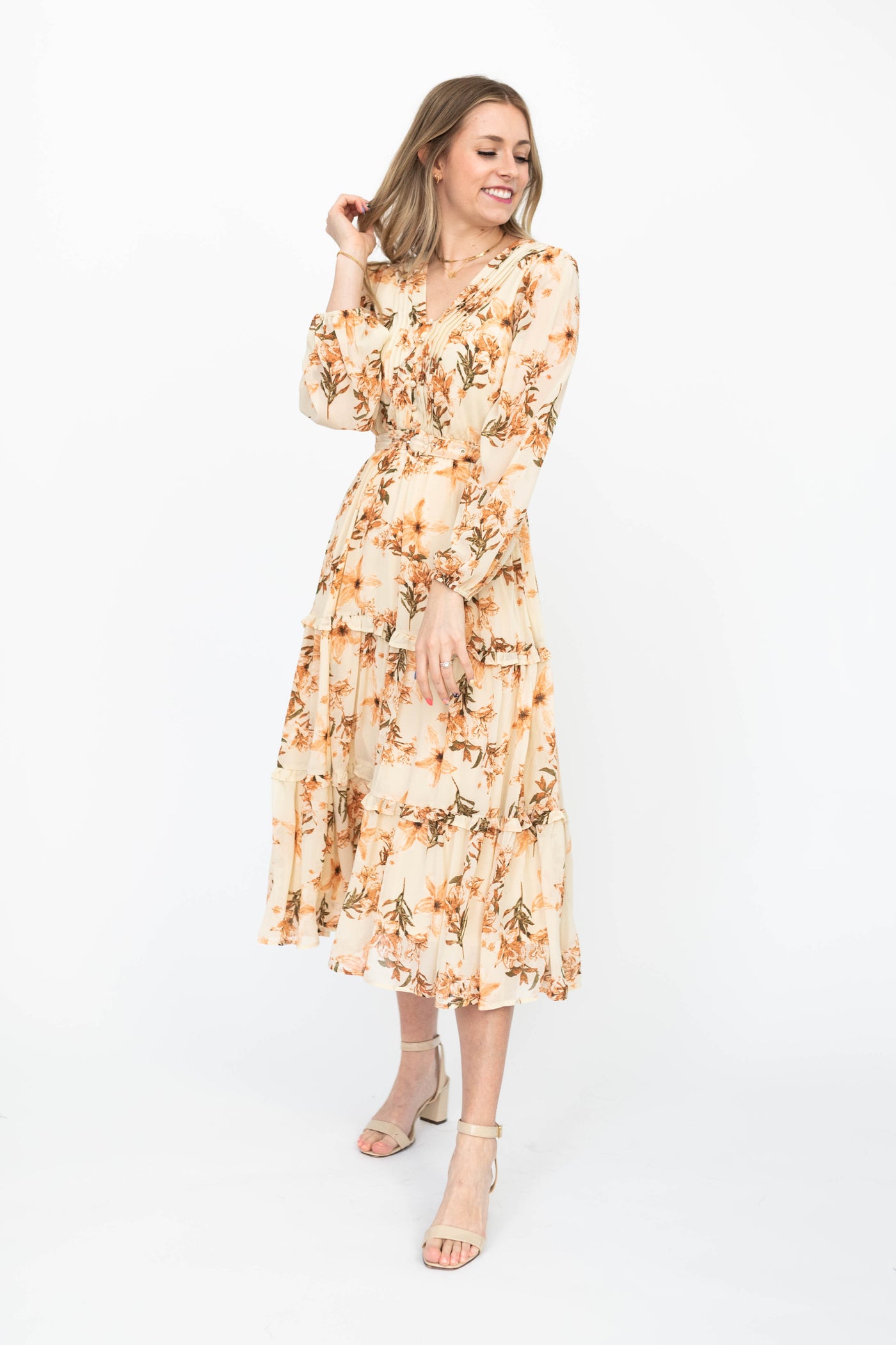 Long sleeve cream dress with floral pattern