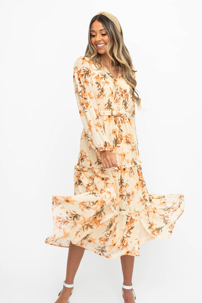 Long sleeve cream dress with flowers and a collar