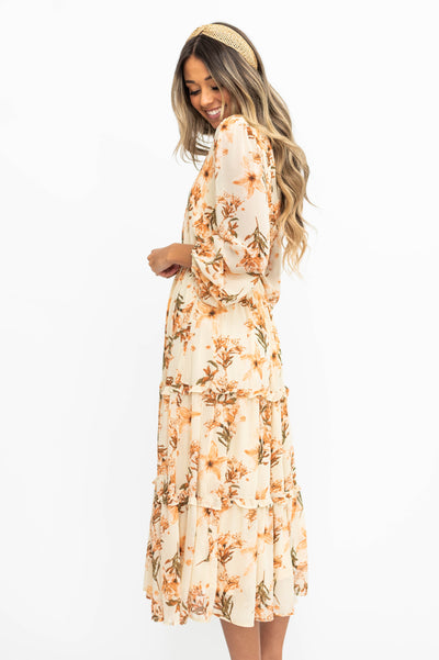 Side view of a cream dress with flowers