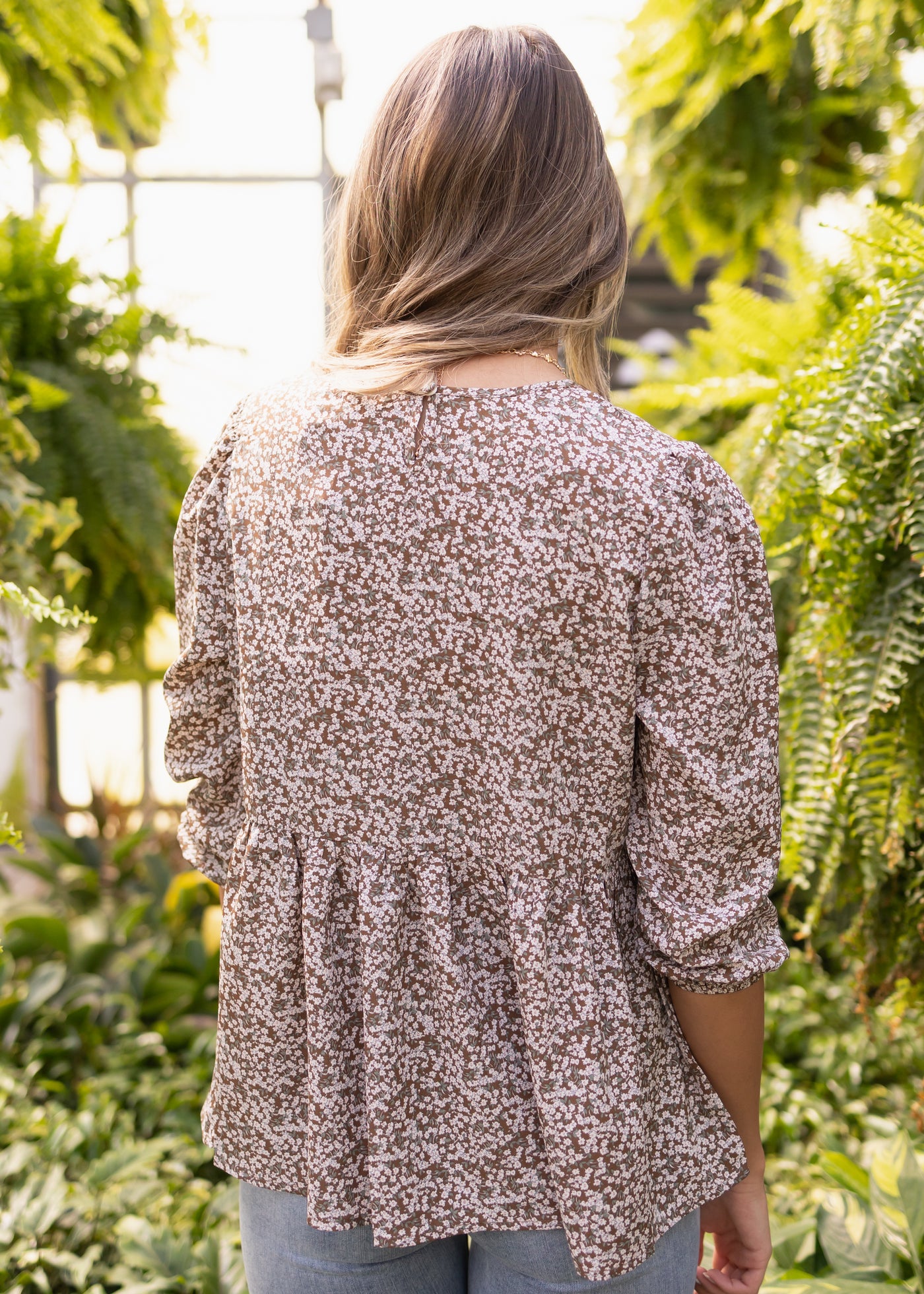 Back of a brown floral top