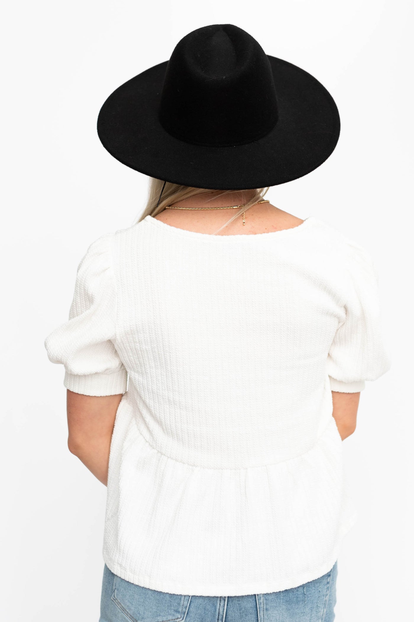 Back view of an ivory top