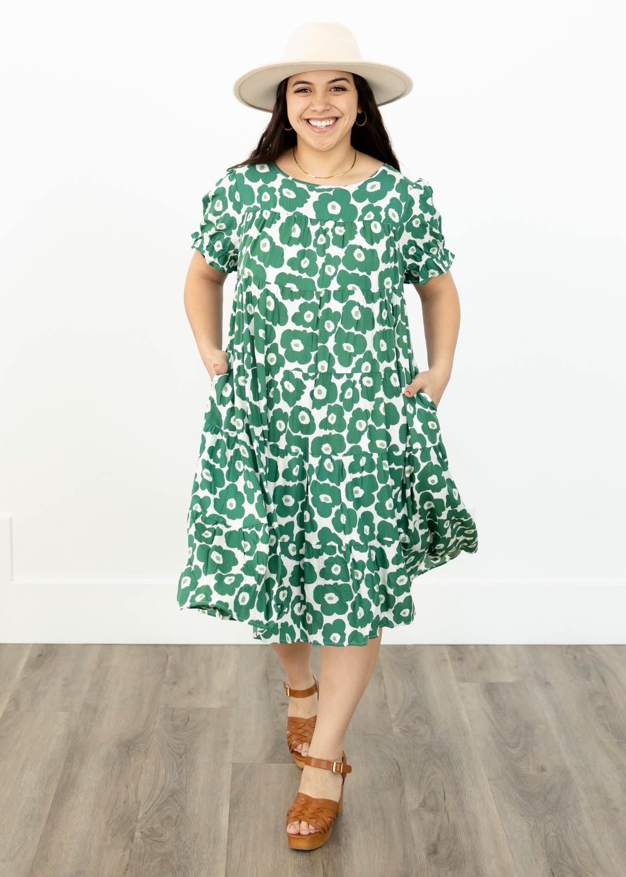Green floral dress with short sleeves and pockets