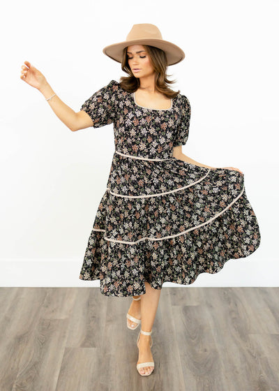 Black floral dress with white trim on the skirt
