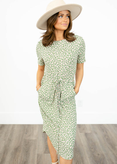 Olive floral dress with short sleeves, pockets and ties at the waist