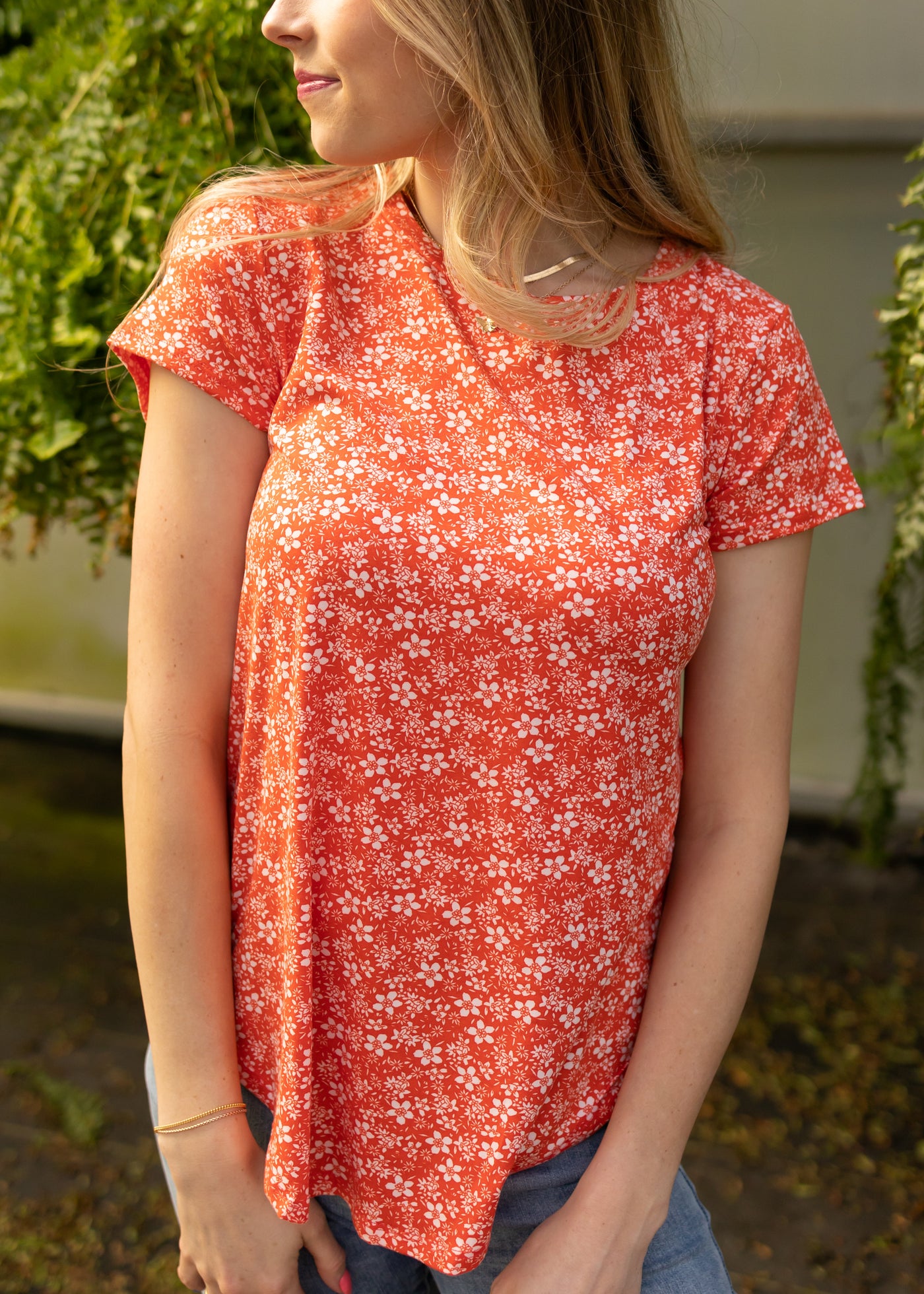 Short sleeve coral red top with small white flowers