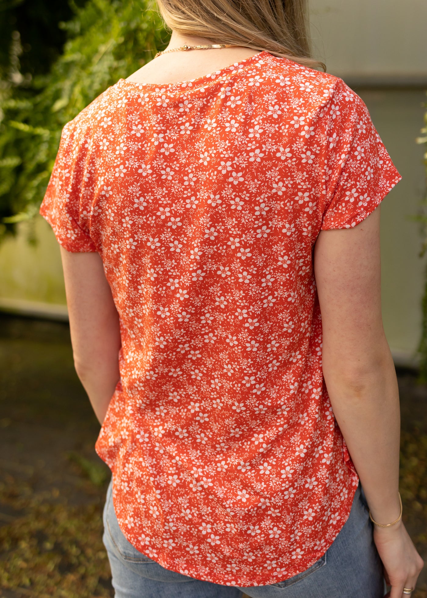 Back view of a coral red top