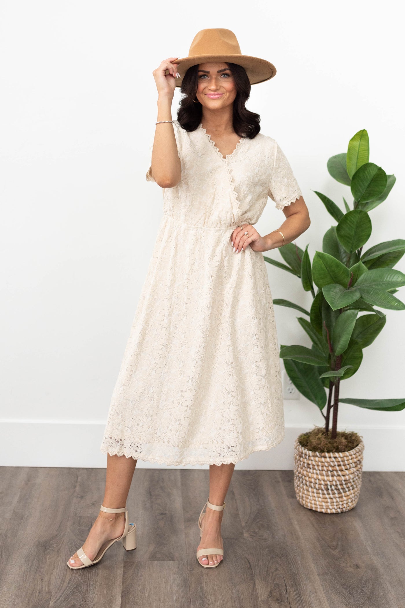 Cream lace dress with lace trim on hem and cuffs of the short sleeves