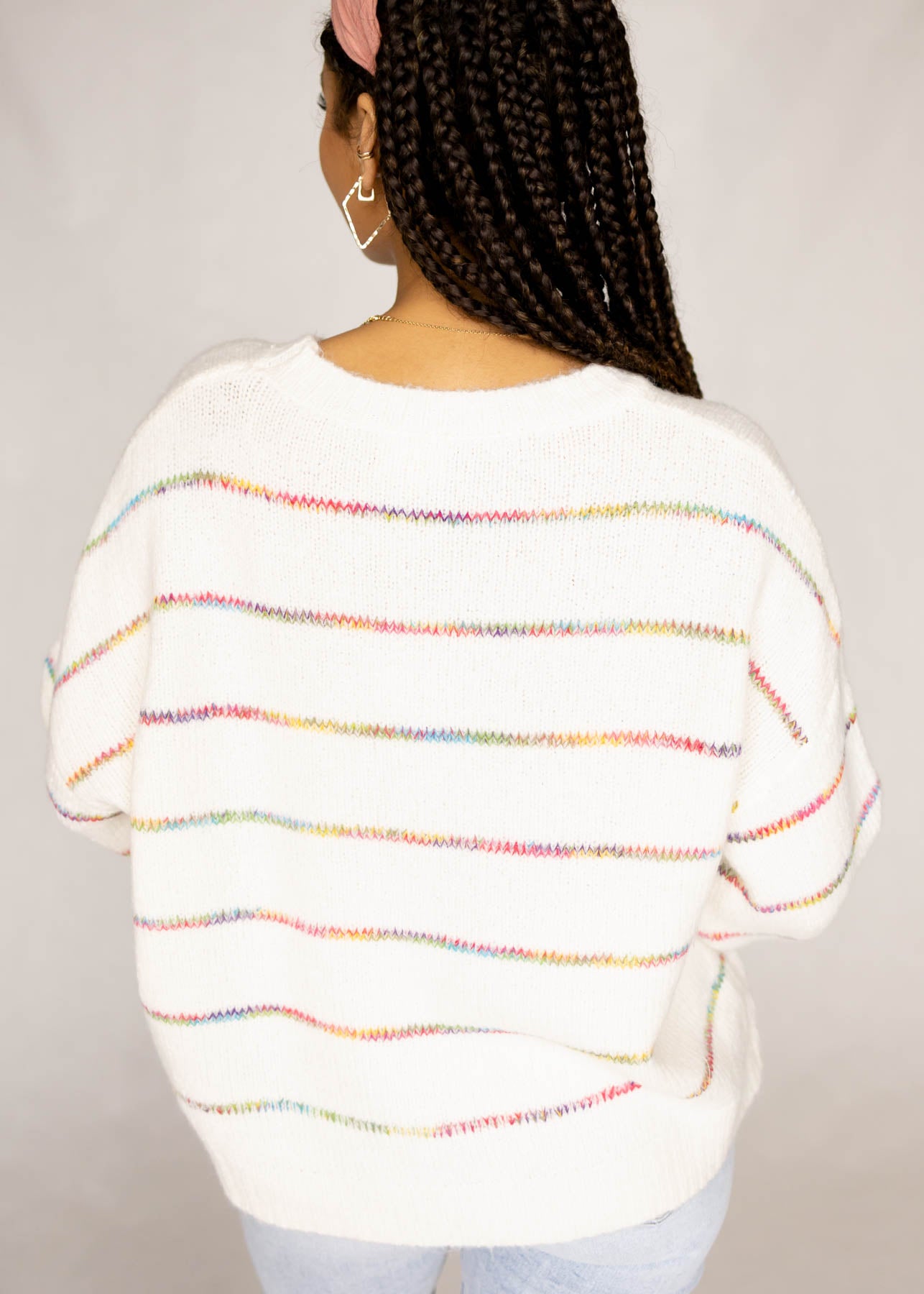 Back view of a ivory sweater