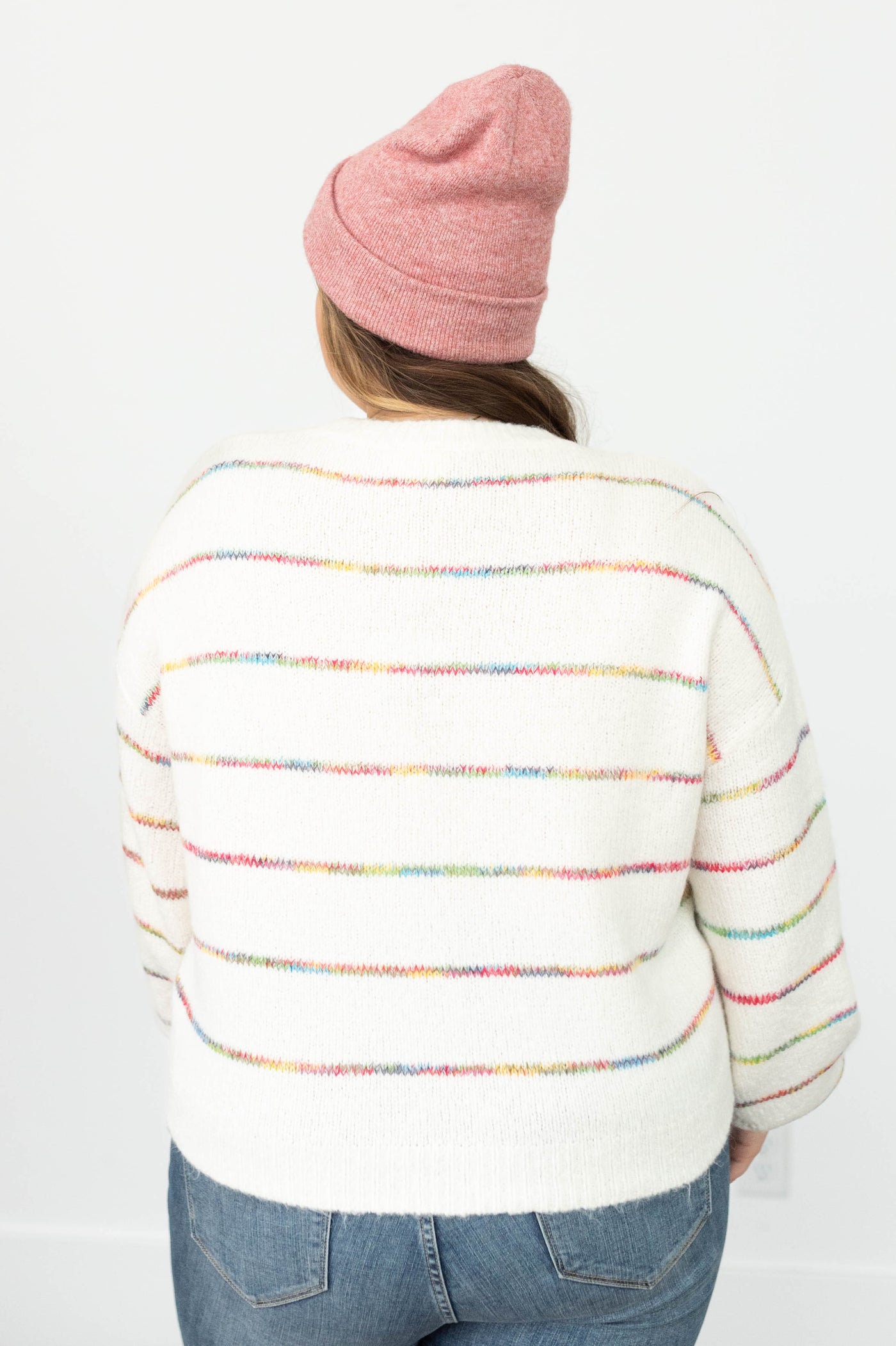 Back view of a plus size ivory sweater