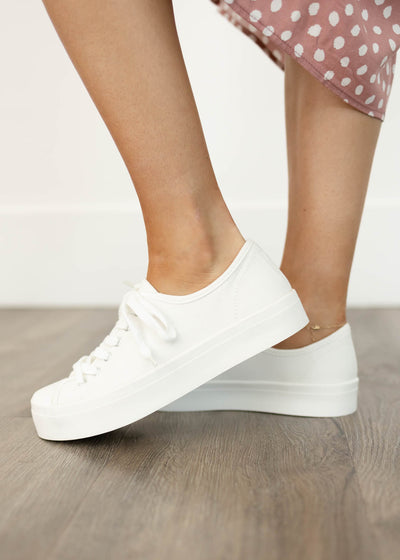 White sneakers that tie