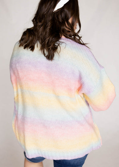 Plus size back view of pastel sweater