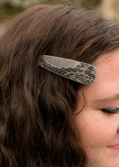 Grey, snake print hair clip. 