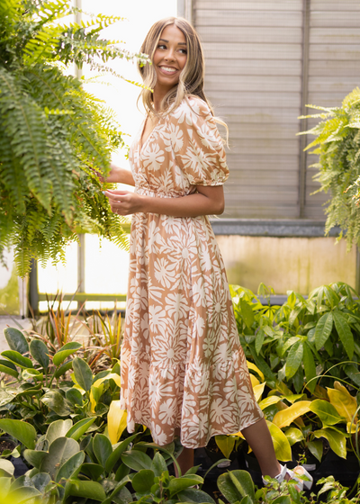 Side view of a short sleeve taupe floral dress