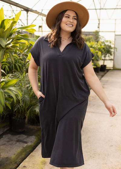 Plus size black dress with a v-neck and collar