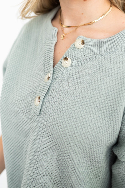 Dusty sage top with buttons at the neck