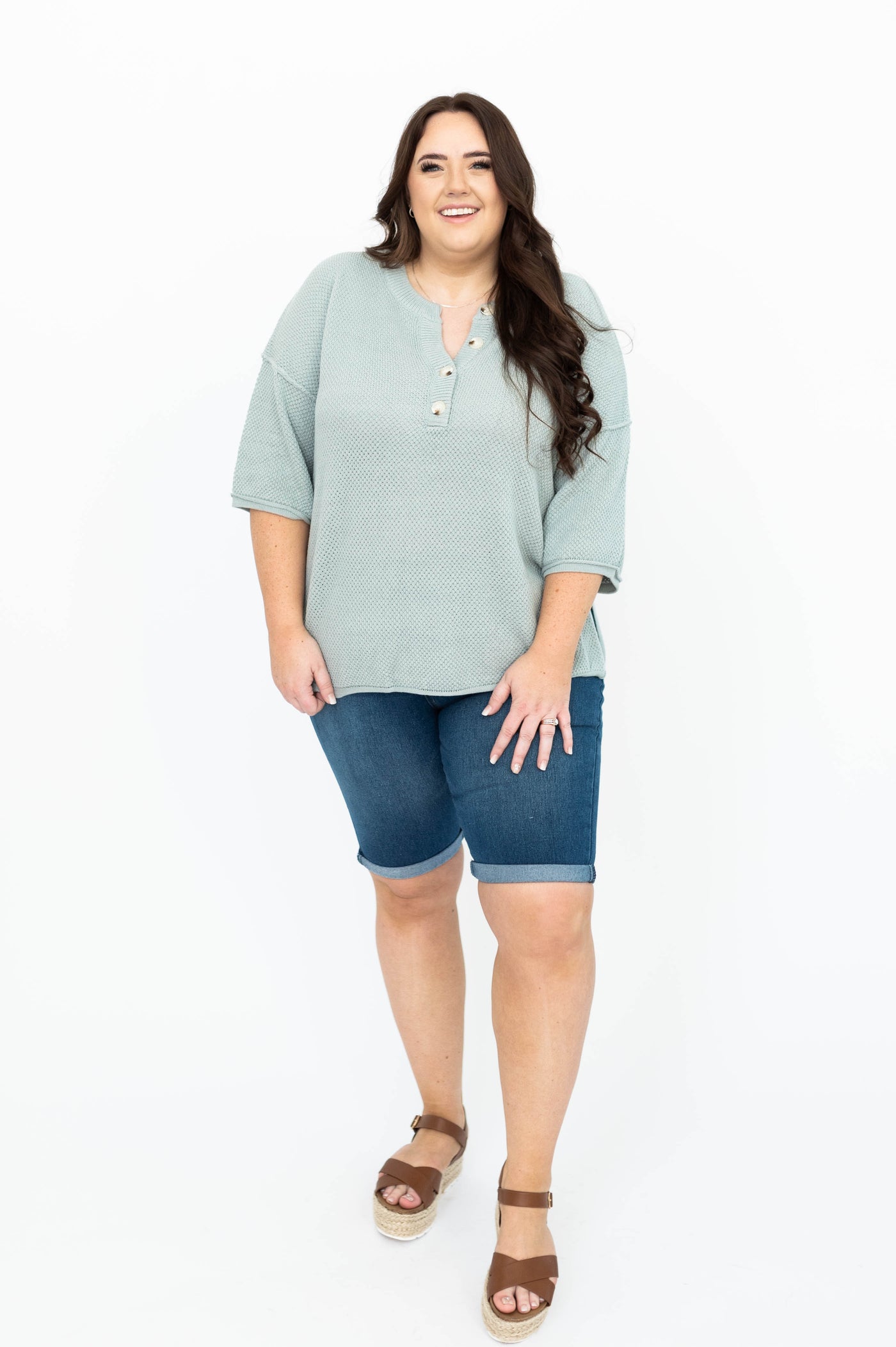 Plus size dusty sage top with short sleeves and buttons at the neck