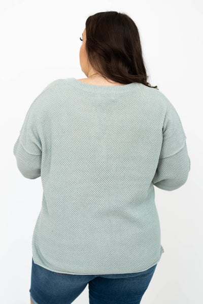 Back view of a plus size dusty sage top