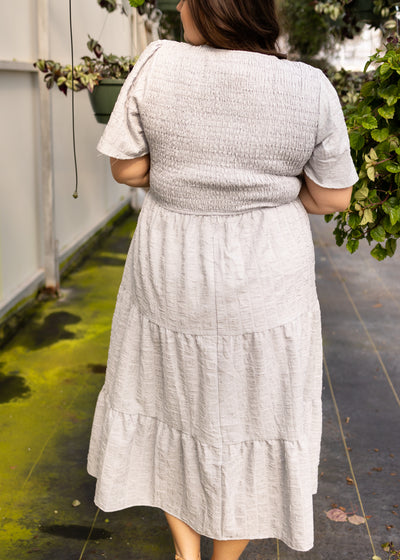 Back view of a plus size grey dress