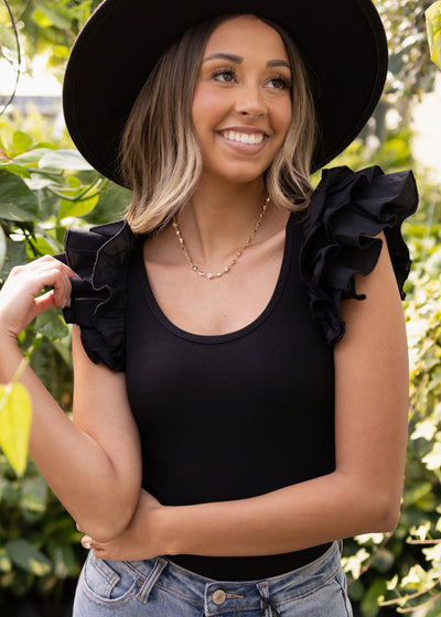 Black bodysuit with ruffle sleeves
