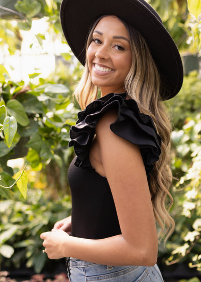 Black bodysuit with ruffles on sleeves