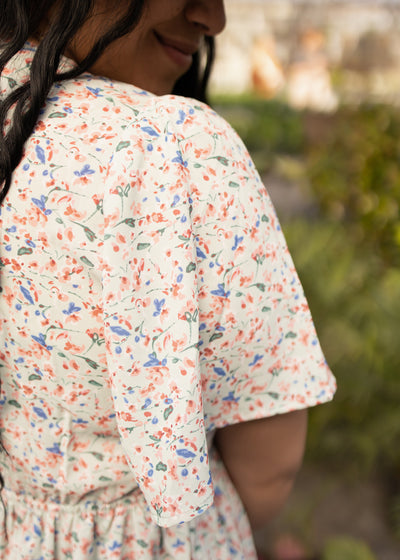 Sleeve of a mint floral dress