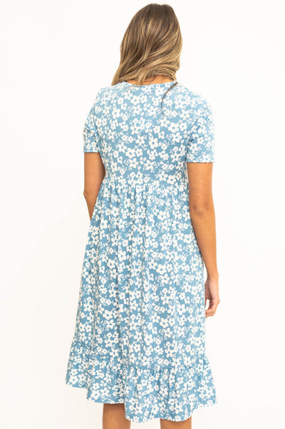 Back view of a blue floral dress