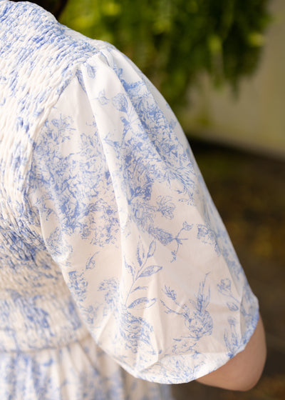 Sleeve of a plus size blue floral dress