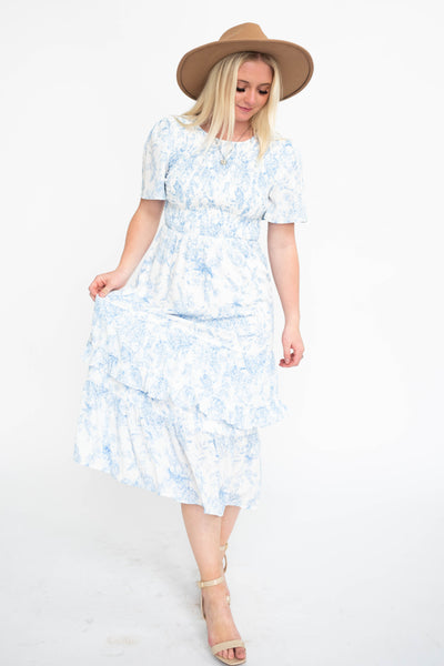 Blue floral dress with ruffle on the skirt and short sleeves