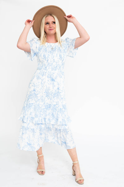 Short sleeve blue floral dress with smocked bodice